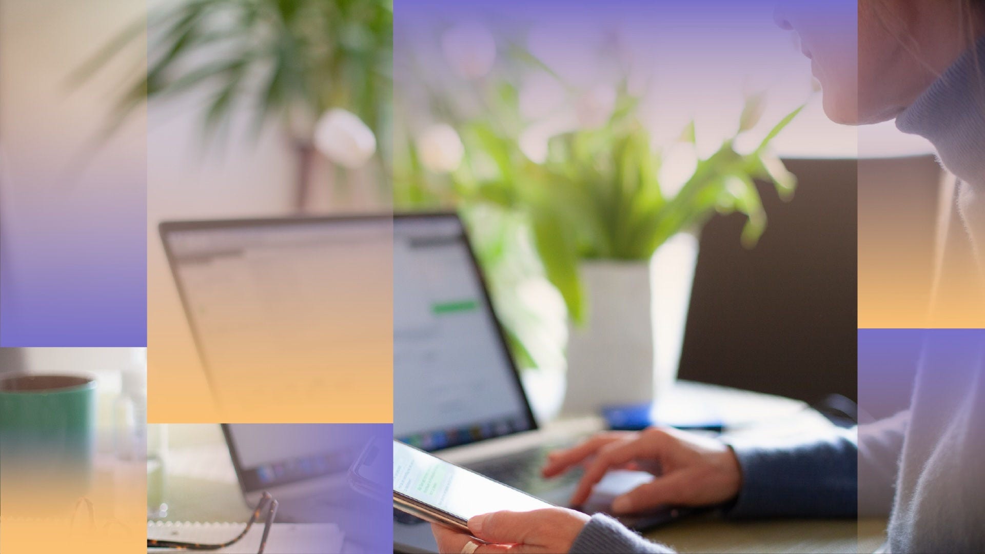 Side photo of a woman working at her laptop while holding a mobile phone.